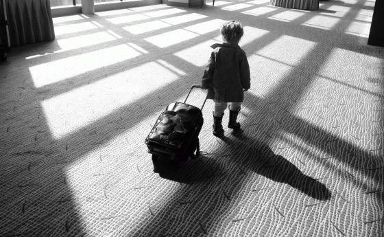 Kid Walking Alone with Luggage